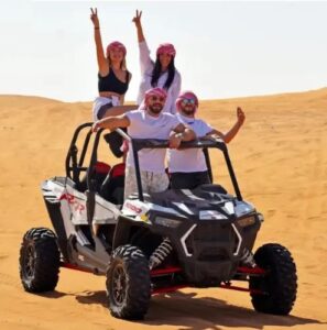 Family taking group photo with 4x4 SUV on Dubai dune bashing tour